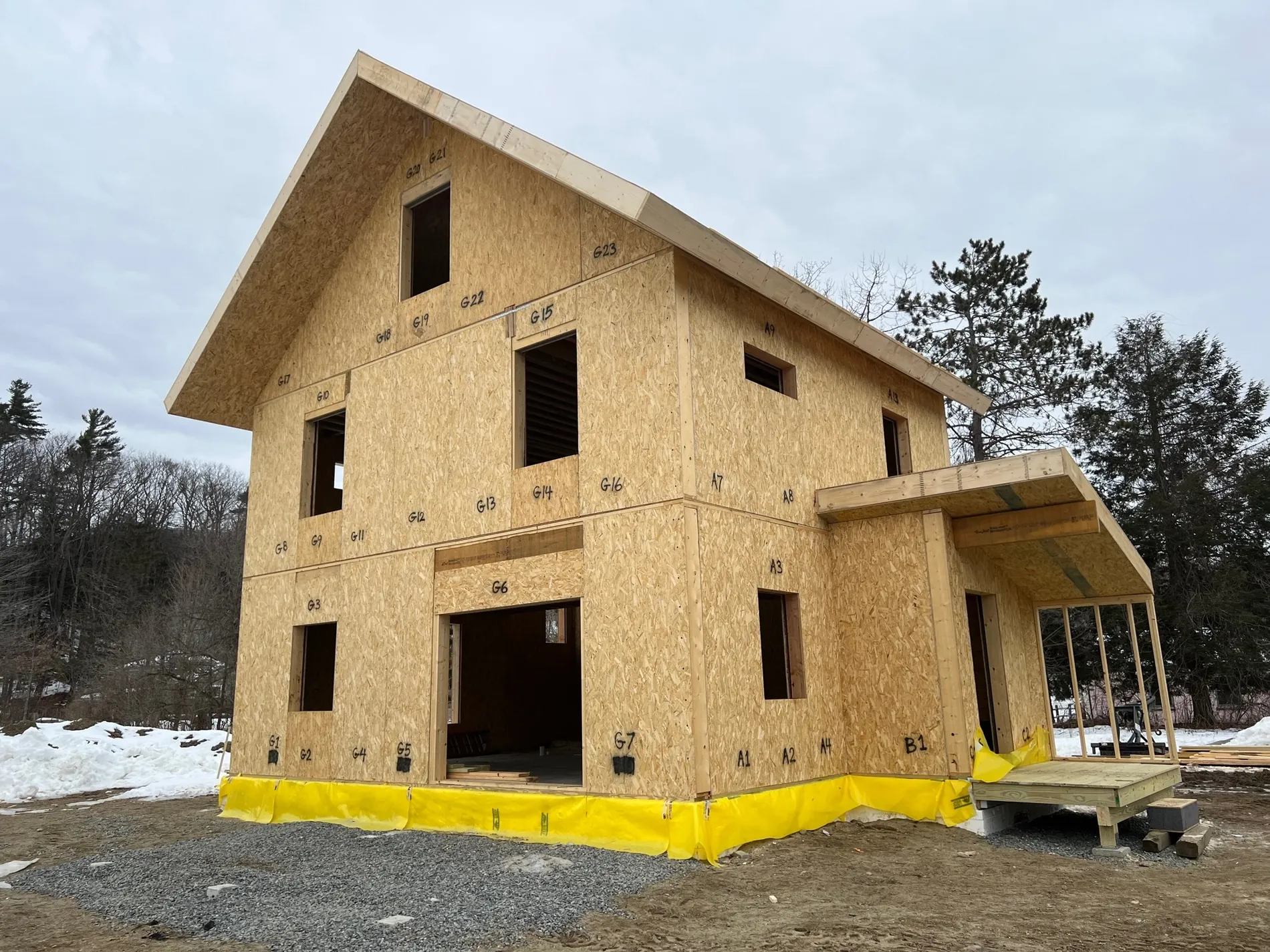 SIP shell of the PHIUS certified house standing closed-in in the snow