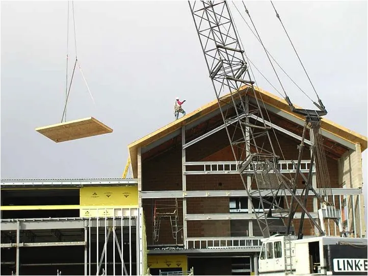 Crane setting a SIP roof panel onto a commercial timber structure